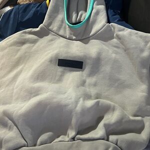 Fear of God Light Gray Hoodie with Teal Accent